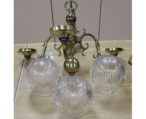 A ceiling light with glass shade