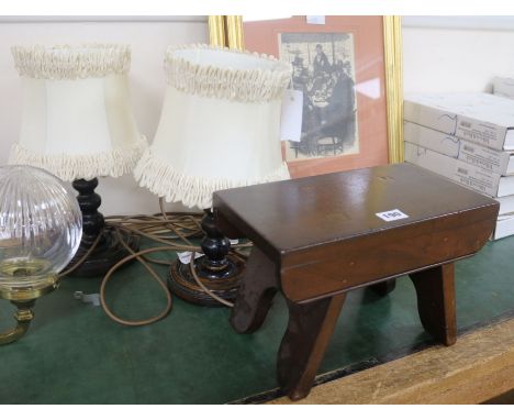 A pair of turned oak table lamps and a stool