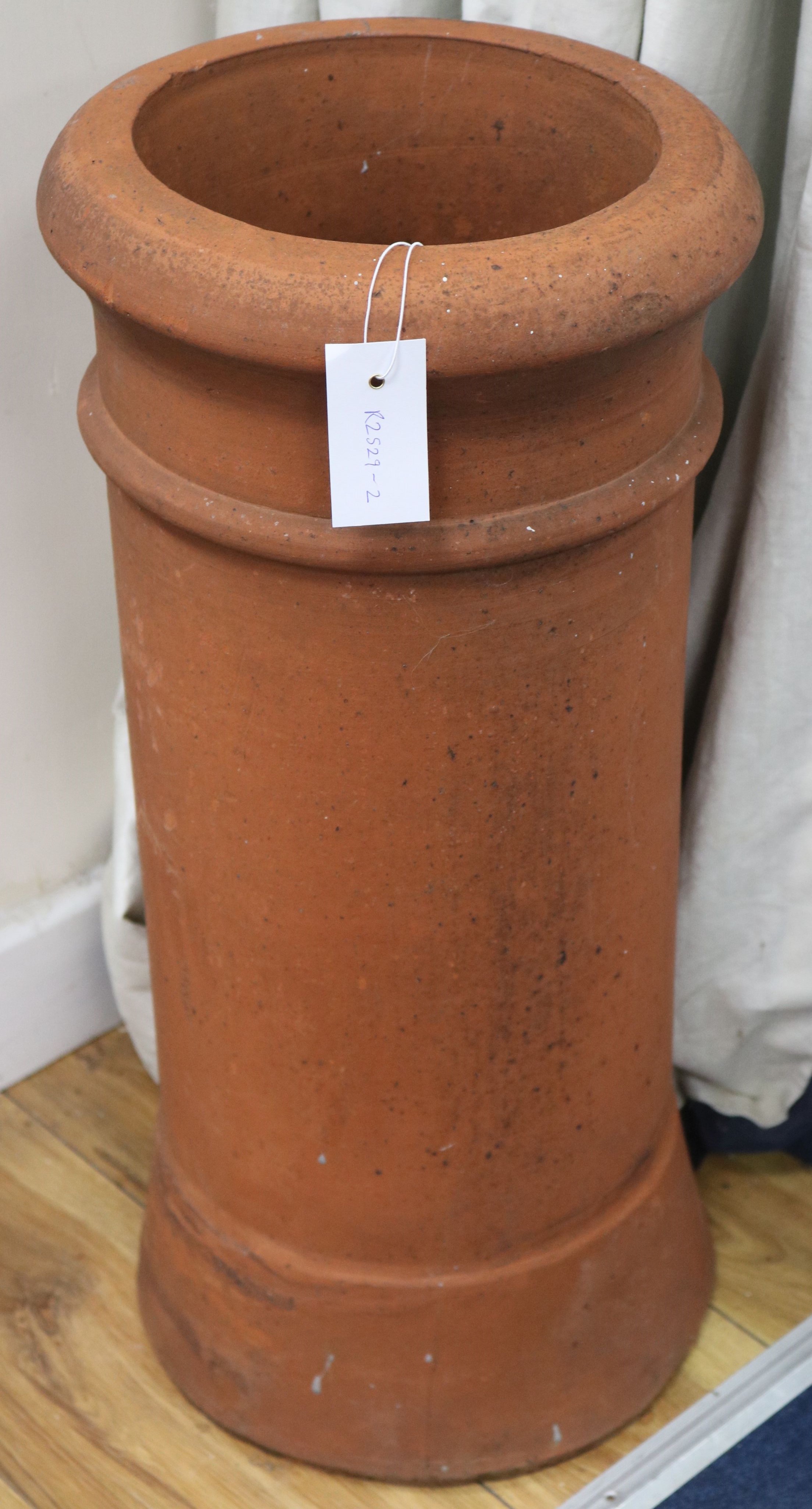 A terracotta chimney pot, H.61cm
