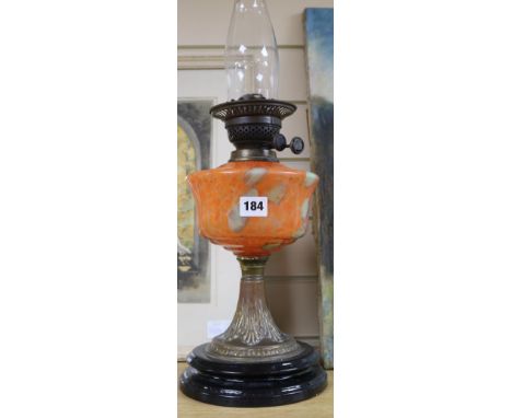 A brass columned oil lamp