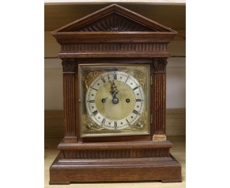 An Edwardian oak twin fusee bracket clock