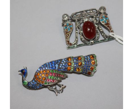 An early 20th century continental 935 standard silver, enamel marcasite and cabochon set brooch and a paste set silver peacoc