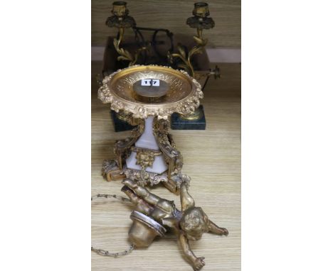 A pair of candlesticks and a candle holder and a hanging putti light drops, etc.