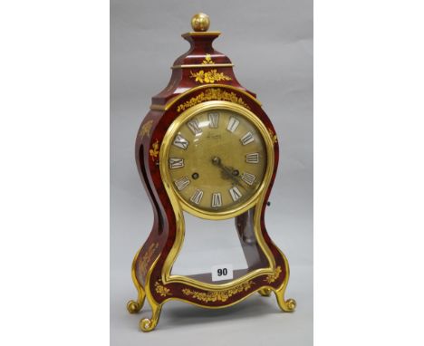 A painted and gilt mantel clock