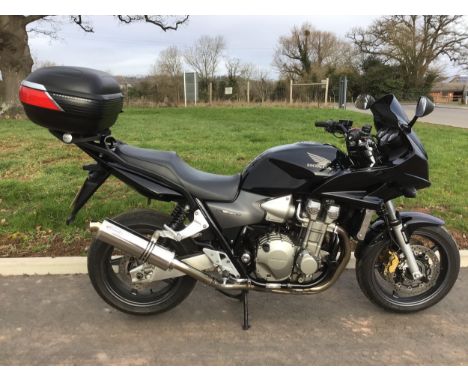 Honda CB1300 motorcycle. 2007. Runs and rides well. Givi Maxia top box and original silencer. Comes with 2 keys, stamped serv