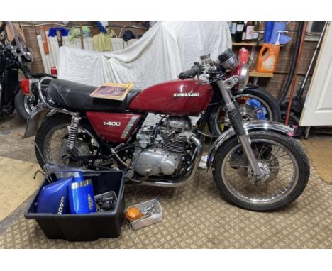 Kawasaki Z400 motorcycle. 1977. Unfinished project. Powder coating has been done. Engine turns over. Comes with box of spares