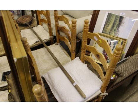 A set of six pine ladder back and rush seated dining chairs 