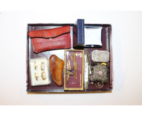 A tray containing a silver Vesta case; a piece of amber; cufflinks; a lighter etc.