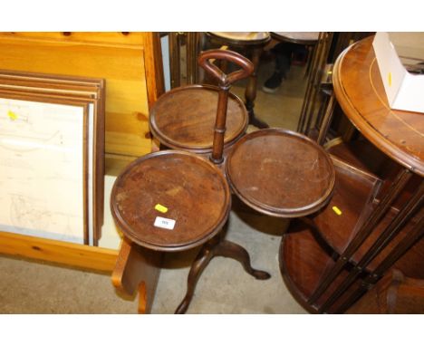 A mahogany triple tripod table
