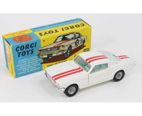 Corgi Toys No. 325 Ford Mustang Fastback 2+2 competition model, comprising of white body with red twin racing stripe, light b