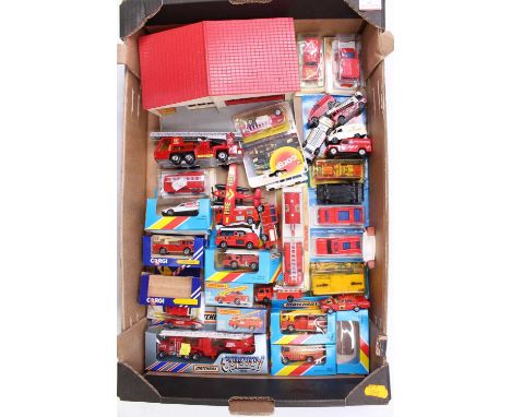 One tray containing a quantity of Matchbox and similar scale carded box and loose emergency and fire service vehicles to incl