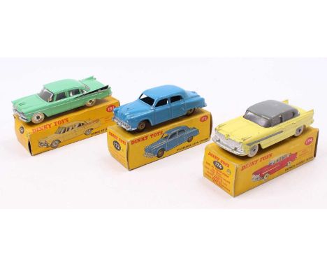 A Dinky Toys group of three to include a Dinky 174 Hudson Hornet Sedan yellow body with dark grey roof and side flash, light 