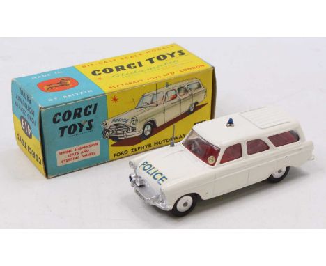 A Corgi Toys 419 Ford Zephyr Motorway Patrol car comprising of white body with red interior and spun hubs with blue roof ligh