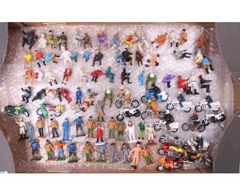 A large tray containing a quantity of plastic and diecast miniatures to include tractor, wagon, bike and motorcycle plastic d