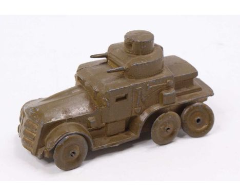 A Charbens lead 6 wheel Armoured Car comprising a single piece casting, finished in brown, with detailed side panels, and tur