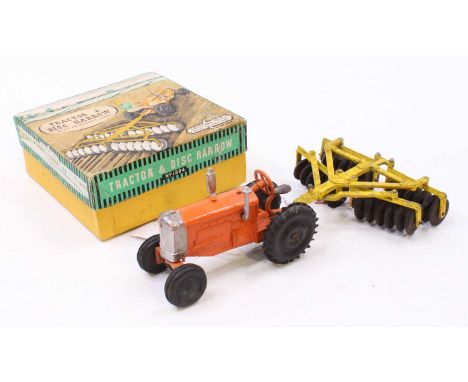 A Crescent Toys No. 1804 tractor &amp; disc harrow box set, comprising orange tractor with silver detailing and black rubber 