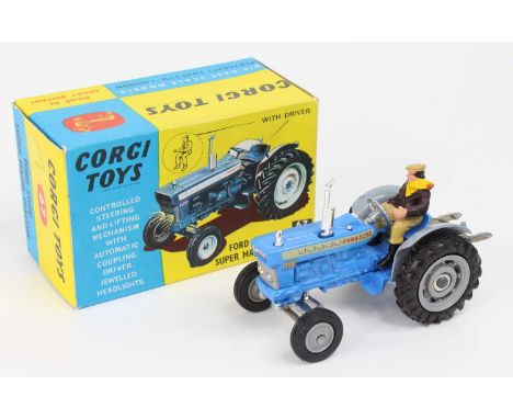 Corgi Toys No. 67 Ford 5000 Super major tractor finished in blue with grey hubs and driver figure, complete with packing card