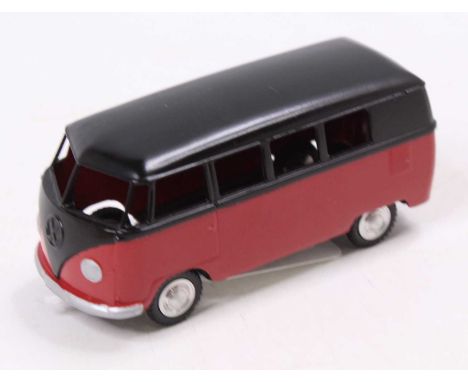A Marklin No. 5524 Volkswagen Kombi, comprising red lower and black upper body with spun hubs, loose example