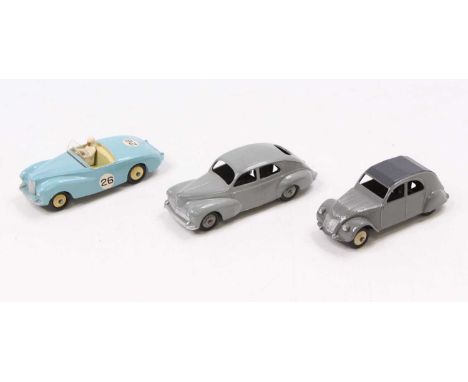 Dinky toys Group of three models to include, French Citroen 2CV in grey body and black roof, ridged cream hubs, French Peugot