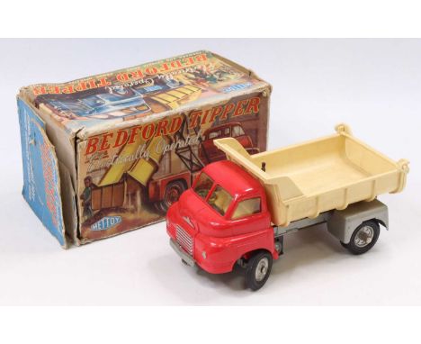A battery operated forward and reverse drive Bedford Tipper by Mettoy No. 926, housed in the original all-card image box (unt