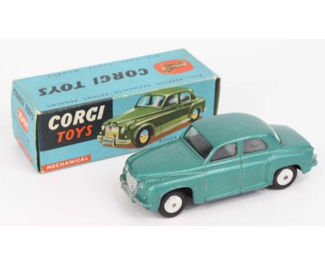 Corgi Toys No. 204M Rover 90 saloon comprising of a metallic blue-green body with spun hubs and windows, the mechanical versi