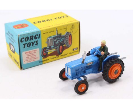 A Corgi Toys No. 60 Fordson Power Major tractor comprising blue body with orange plastic hubs and driver figures, housed in t