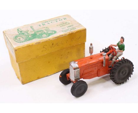 A Crescent Toys No. 1805 Agricultural tractor, comprising orange body with silver detailing and black rubber tyres, brown sea