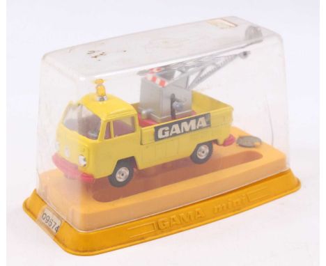 A Gama No. 09574 Volkswagen breakdown truck comprising of yellow body with red bumper and matching red interior with grey jib