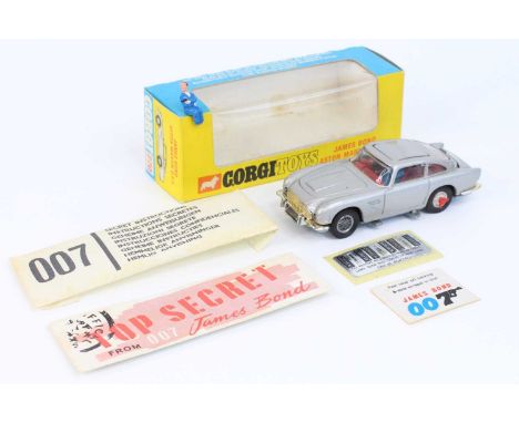 Corgi Toys No. 270 James Bond Aston Martin DB5 comprising of silver body with red interior, with Bond driver figure and Bandi