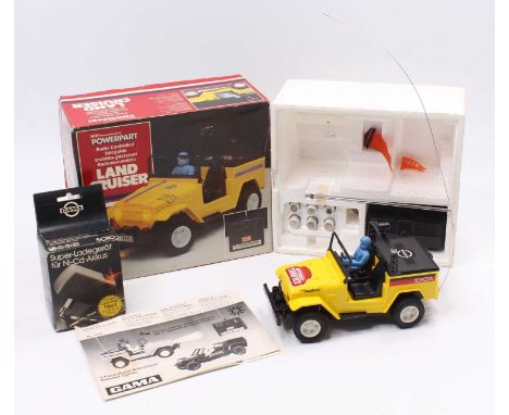 A Massey Ferguson Power Part made in Japan radio controlled model of a Power Part Landcruiser, together with a Gama charging 