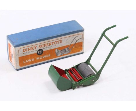 A Dinky Toys No. 751 lawnmower comprising green body with heavy roller and red blades housed in the original orange and white