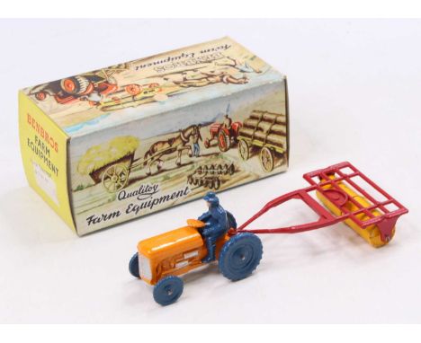 A Benbros Farm Equipment series boxed farm tractor and roller, comprising orange tractor with blue wheels and driver figure c