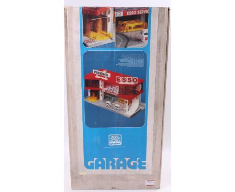 A Coqueval of France plastic Esso Service garage housed in the original labelled white ground card box