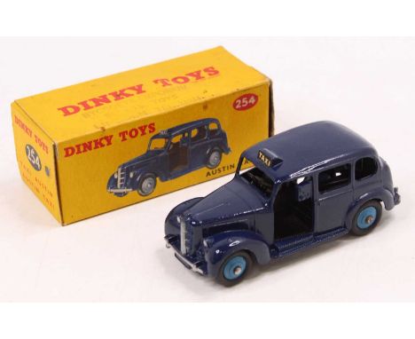 Dinky toys, 254 Austin Taxi, In dark blue body with black interior, light blue hubs and black tyres, housed in the original c