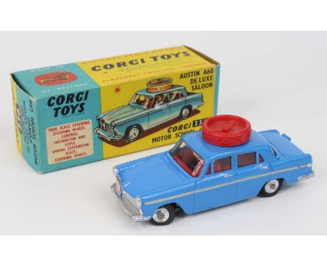 Corgi Toys No. 236 Austin A60 Motor School Car comprising of rare dark blue body with red interior, and spun hubs with workin