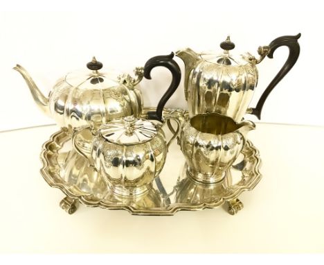 A Silver Four-Piece Tea and Coffee Service and Tray:Comprising matching engraved melon-shape patterned service, the tea and c