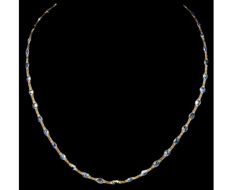 A 14ct Yellow Gold Oval Cut Ceylon Sapphire Single Strand Necklace:Comprising 42 oval cut sapphires set on an 18 inch chain.W