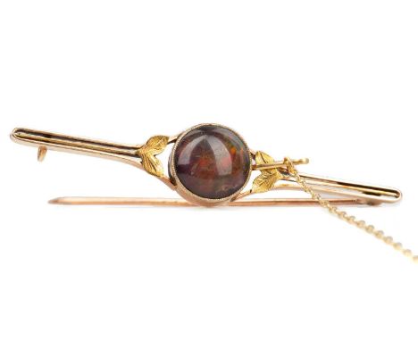 BLACK OPAL BAR BROOCH,set with a round cabochon black opal, marked 15C to the reverse, 5g