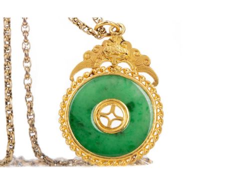 JADE PENDANT,the circular revolving section within an unmarked high carat gold mount, on a chain marked 9C, 14.9g30mm in diam