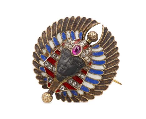 LATE 19TH CENTURY EGYPTIAN REVIVAL BROOCH,modelled in relief with a pharaoh set with diamonds and red enamel, central cabocho