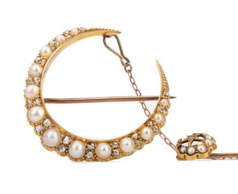 VICTORIAN PEARL AND DIAMOND CRESCENT MOON BROOCH,formed by graduated pearls interspaced by pairs of old cut diamonds, in fift