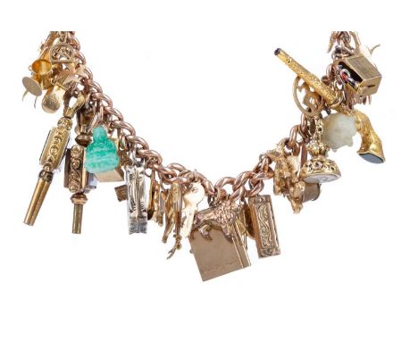 IMPRESSIVE GOLD CHARM BRACELET,heavily populated with charms including a miniature silver vinaigrette, jade buddha gem set po