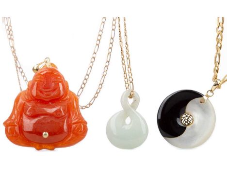 TWO HARDSTONE PENDANTS AND ONE OTHER,comprising an orange jade buddha and another jade pendant on a nine carat gold chain, 1.