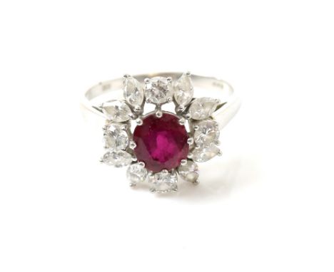 1970's cluster ring, set with central oval cut synthetic ruby, 7.0 x 6.4mm, surrounded by round brilliant and marquise cut di