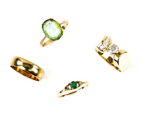 A group of gold rings, one abstract form set with cubic zirconia, ring size N, another set with emerald and round brilliant c