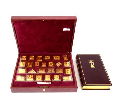 'The Empire Collection' silver-gilt proof replica stamps, with certificate of authenticity no. 1474/10000, comprising 25 gold