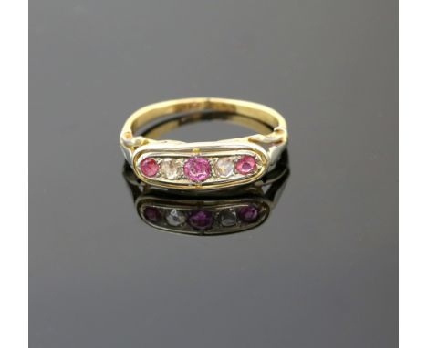 A Edwardian ring set with pink sapphire and rose cut diamonds, mount testing as 18 ct gold, ring size M 1/2,.   CONDITION18 c