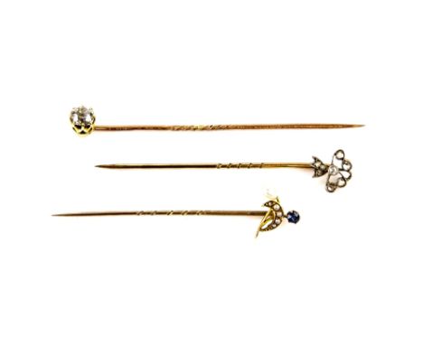 Three stick pins, one set with an old cut diamond, estimated diamond weight 0.45 carat, with changeable screw thread setting 