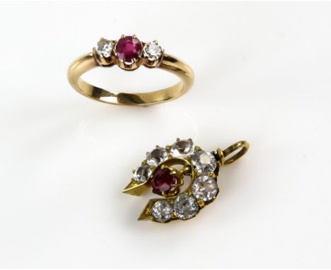 Ruby and diamond three stone ring,  with central step cut ruby within a border of brilliant cut diamonds, diamond weight esti