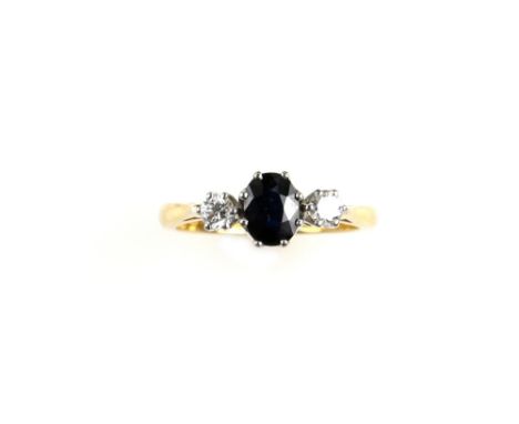 Vintage sapphire and diamond dress ring, centrally set oval cut sapphire, with two round brilliant cut diamonds, ring size O,